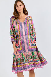 Model Genericm wearing size sample of the Zilara Dress – Orchid in colour Orchid, in a cropped view