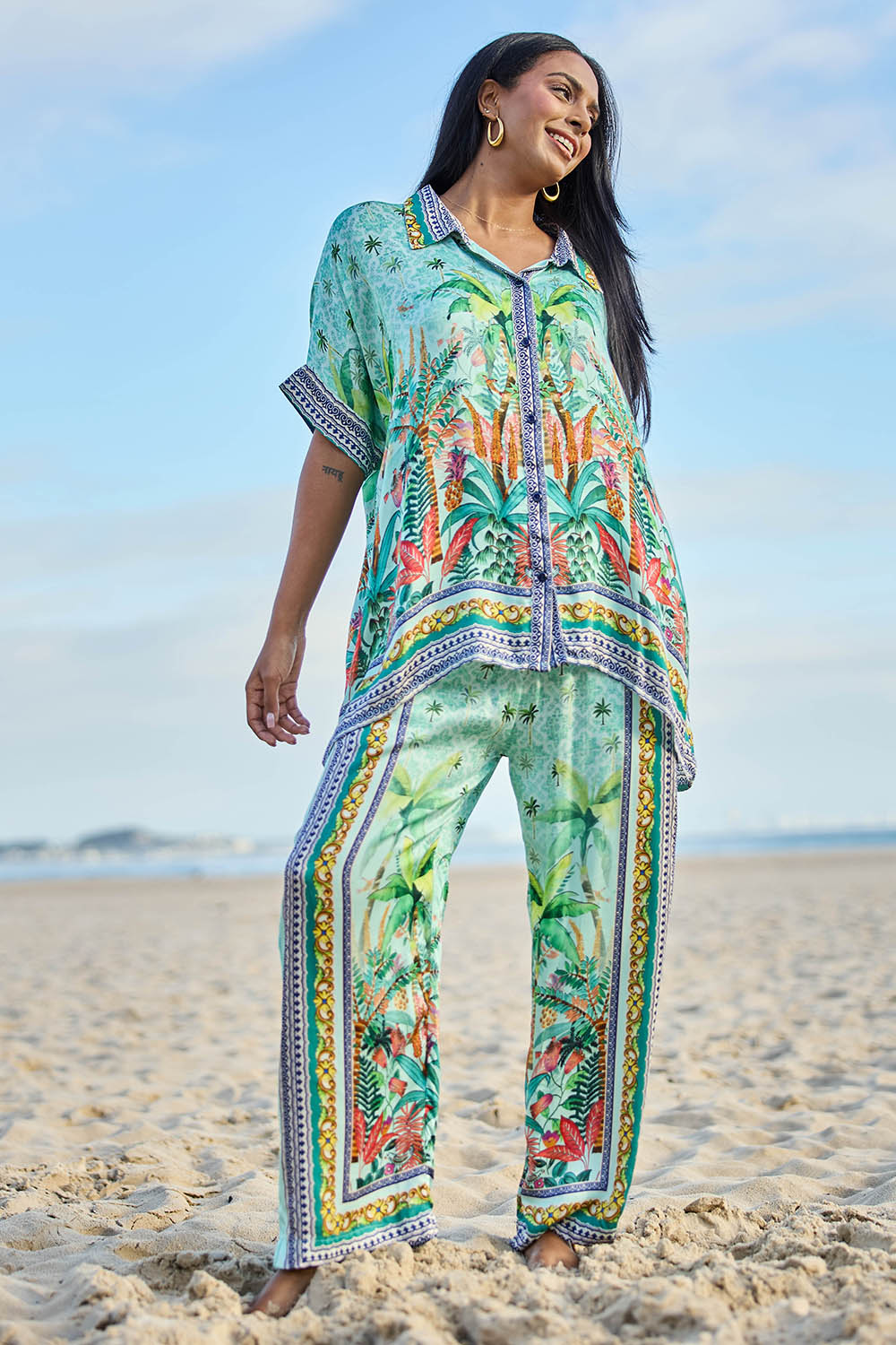 Model Eshan wearing size 10 of the Zilara Kaftan Top – Mist in colour Mist, from the front