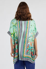 Model Genericm wearing size sample of the Zilara Kaftan Top – Mist in colour Mist, from the back
