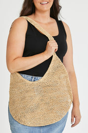 Model Tahlecia wearing size OneSize of the Mamy Bag in colour Natural, from the front, cropped image