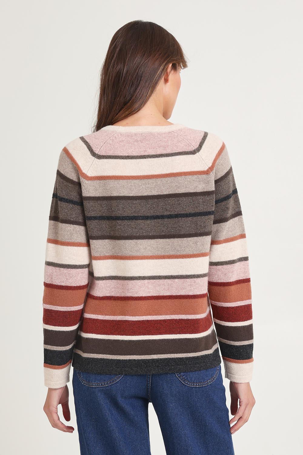 Model Madeline wearing size S of the Aline Lambswool Sweater in colour Darkbrown, from the back