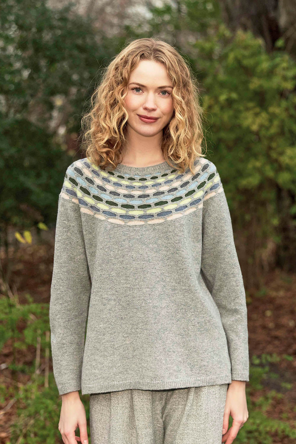 A model wearing the Brigitte Lambswool Sweater in colour Grey (Grey), from the front, showing the whole outfit