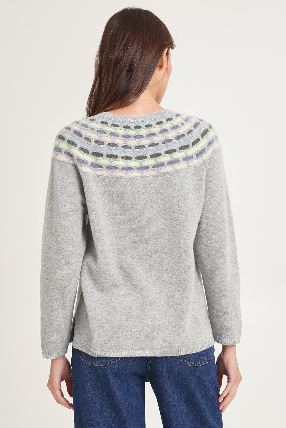 Model Madeline wearing size S of the Brigitte Lambswool Sweater in colour Grey (Grey), from the back
