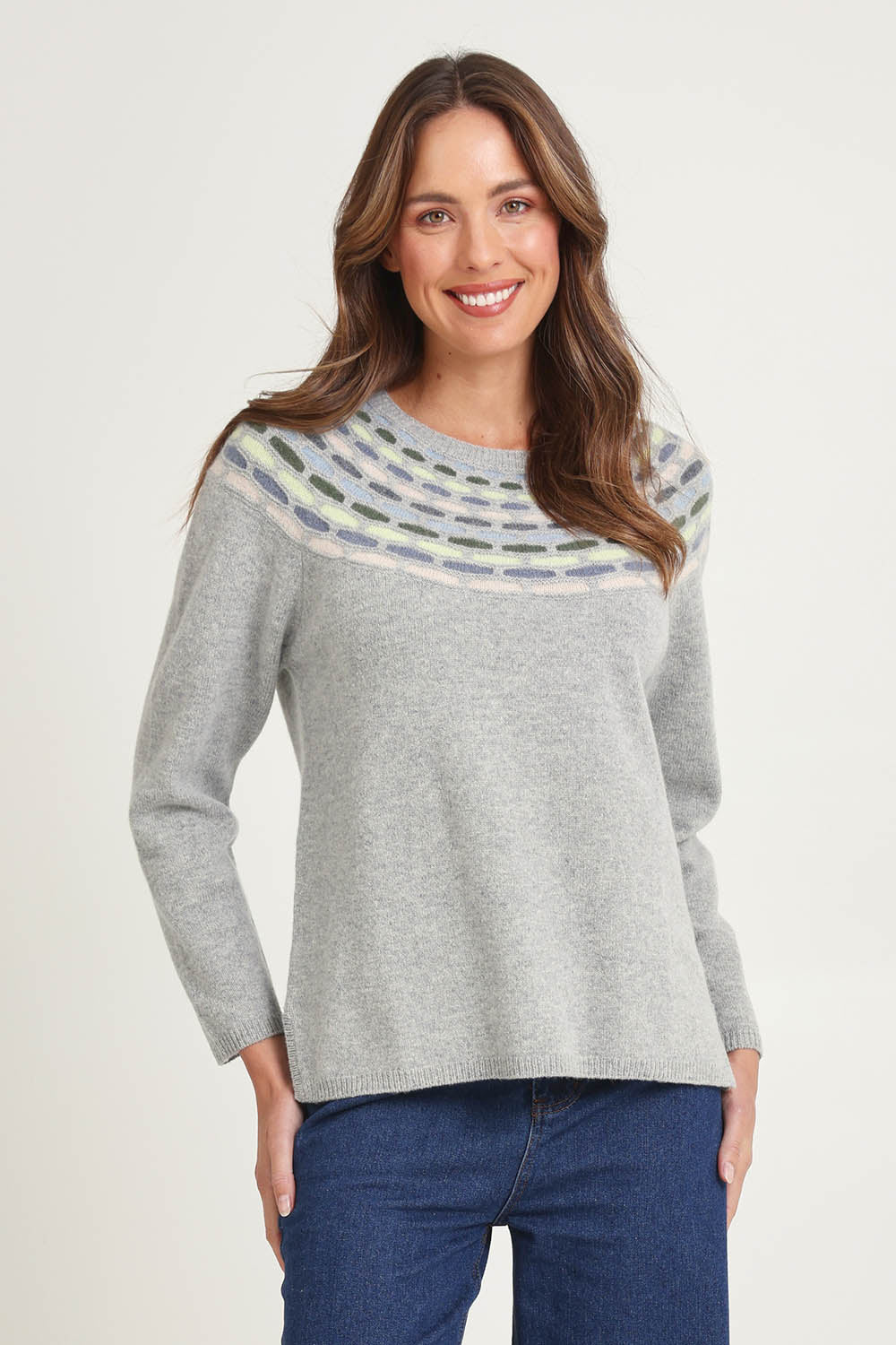 Model Madeline wearing size S of the Brigitte Lambswool Sweater in colour Grey (Grey), from the front, cropped image