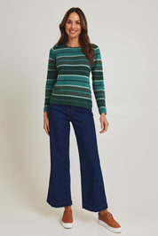 Model Madeline wearing size S of the Chloe Merino Cotton Sweater in colour Emerald (Green), from the front, showing the whole outfit