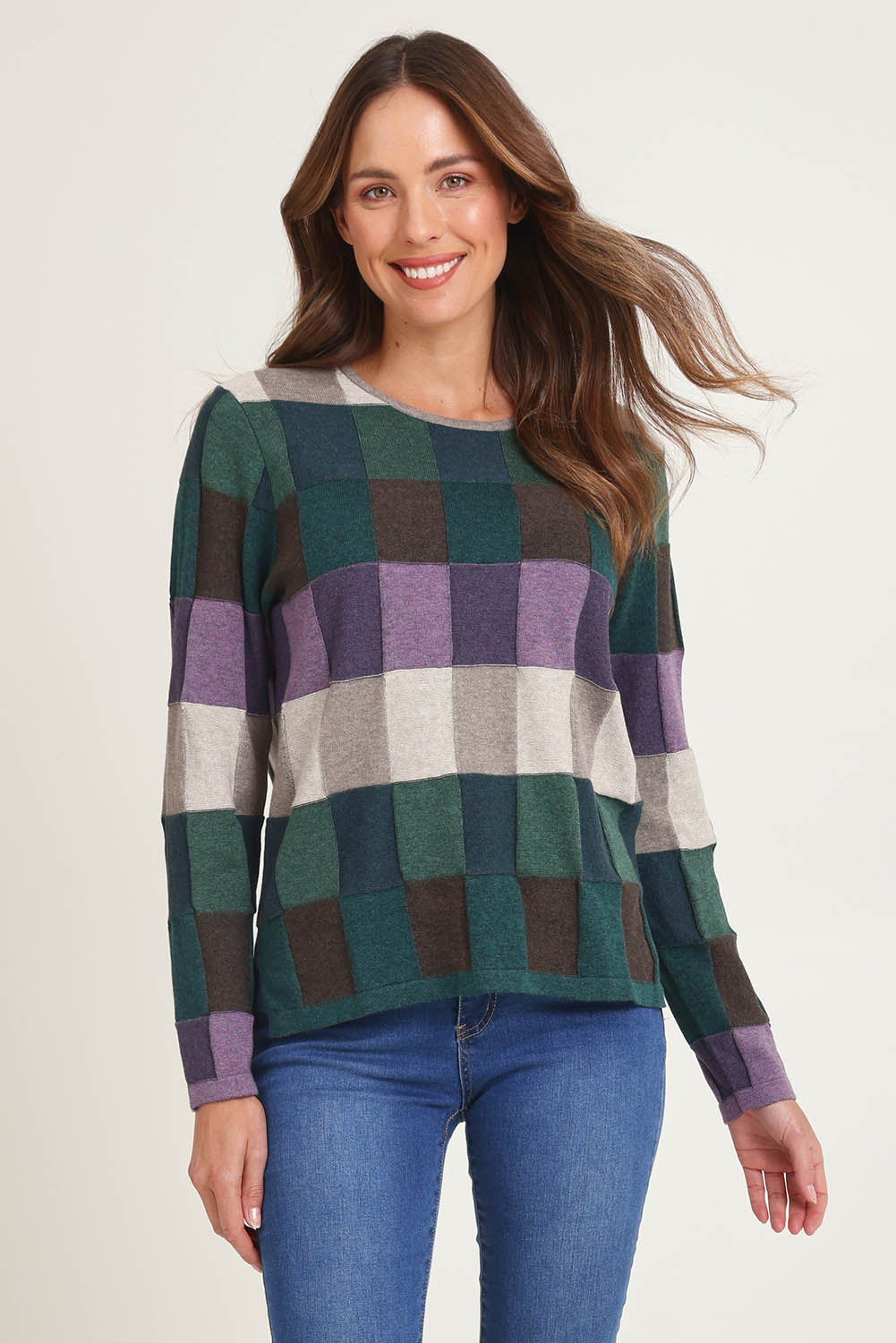 Model Madeline wearing size S of the Lillith Organic Cotton Sweater in colour Coldgreen (Green), from the front, cropped image