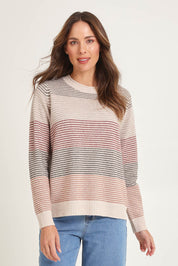 Model Madeline wearing size S of the Louise Lambswool Sweater in colour Oat, from the front, cropped image