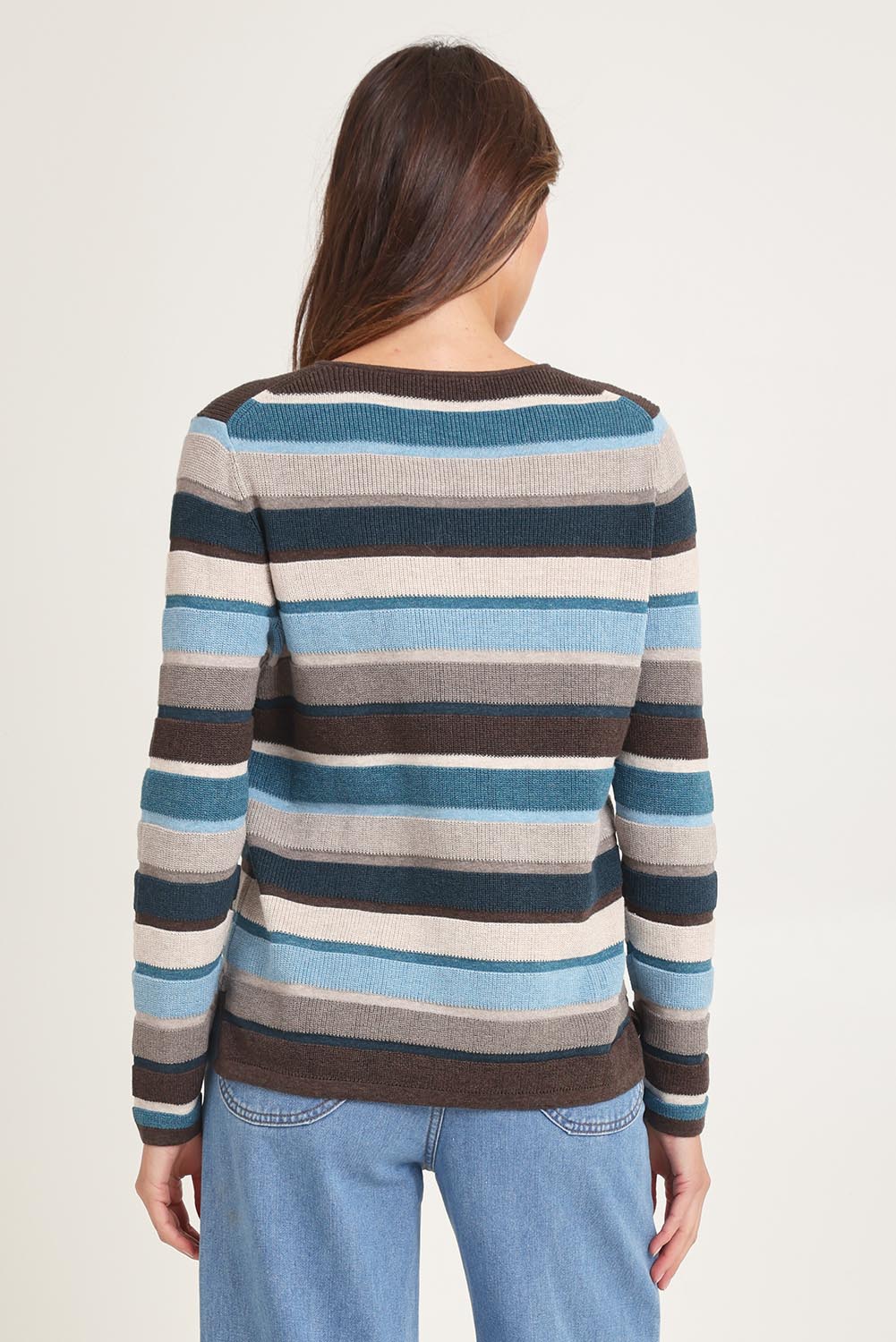 Model Madeline wearing size S of the Mathilde Organic Cotton Sweater in colour Darkbrown (Blue), from the back