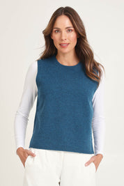 Model Madeline wearing size S of the Mitos Vest in colour Darkaqua (Green), from the front, cropped image