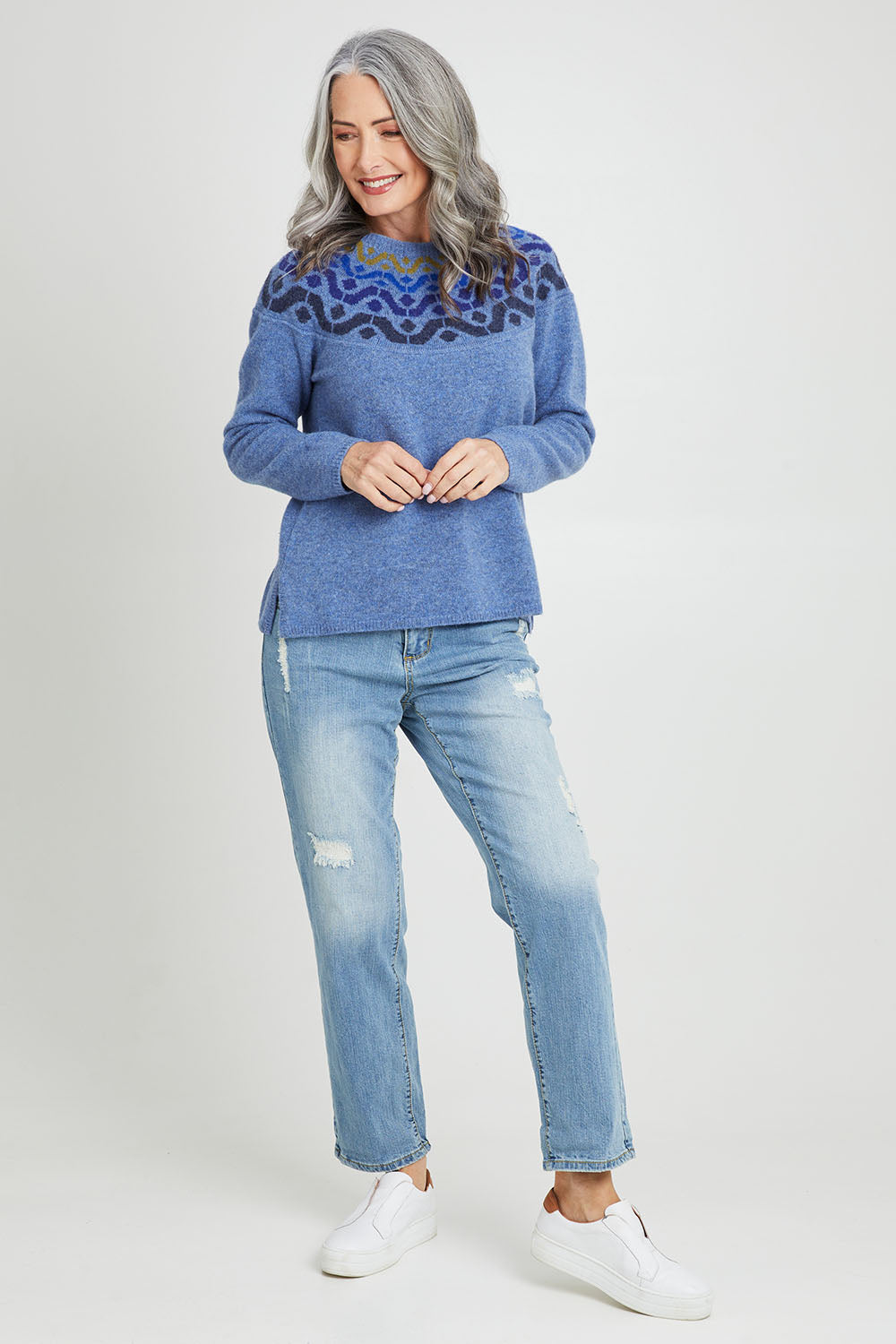 Model Luisa wearing size S of the Vonda Sweater in colour Denim (Blue), from the front, showing the whole outfit