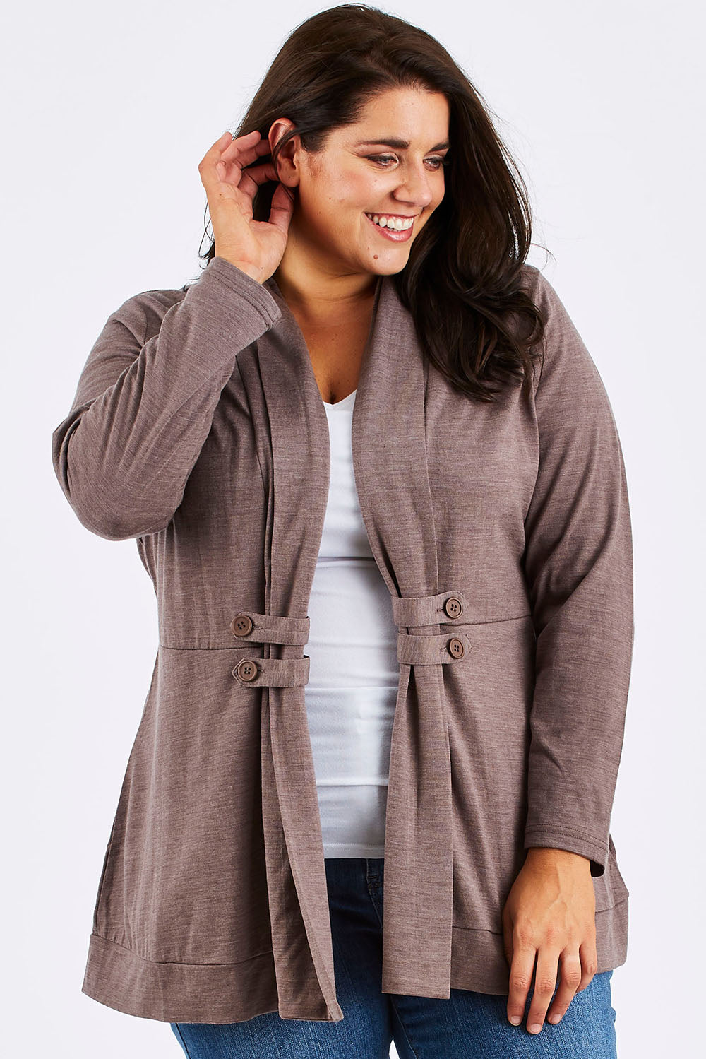 Model Mae wearing size 18 of the Merino Side Button Cardigan in colour Mocha, from the front, cropped image