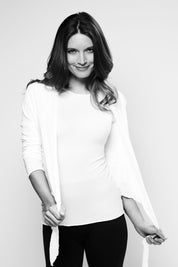 A model wearing the Basic Tie Long Sleeve Wrap Cardi in colour White (White), from the front, showing the whole outfit