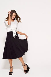 A model wearing the Basic Tie Long Sleeve Wrap Cardi in colour White (White), from the front, showing the whole outfit