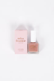 A model wearing size OneSize of the Chip Resistant Nail Polish in colour Firstdate (Red), from the front, showing the whole outfit