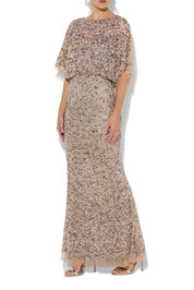 A model wearing the Mimi Hand Beaded Gown in colour Mink, from the front, cropped image