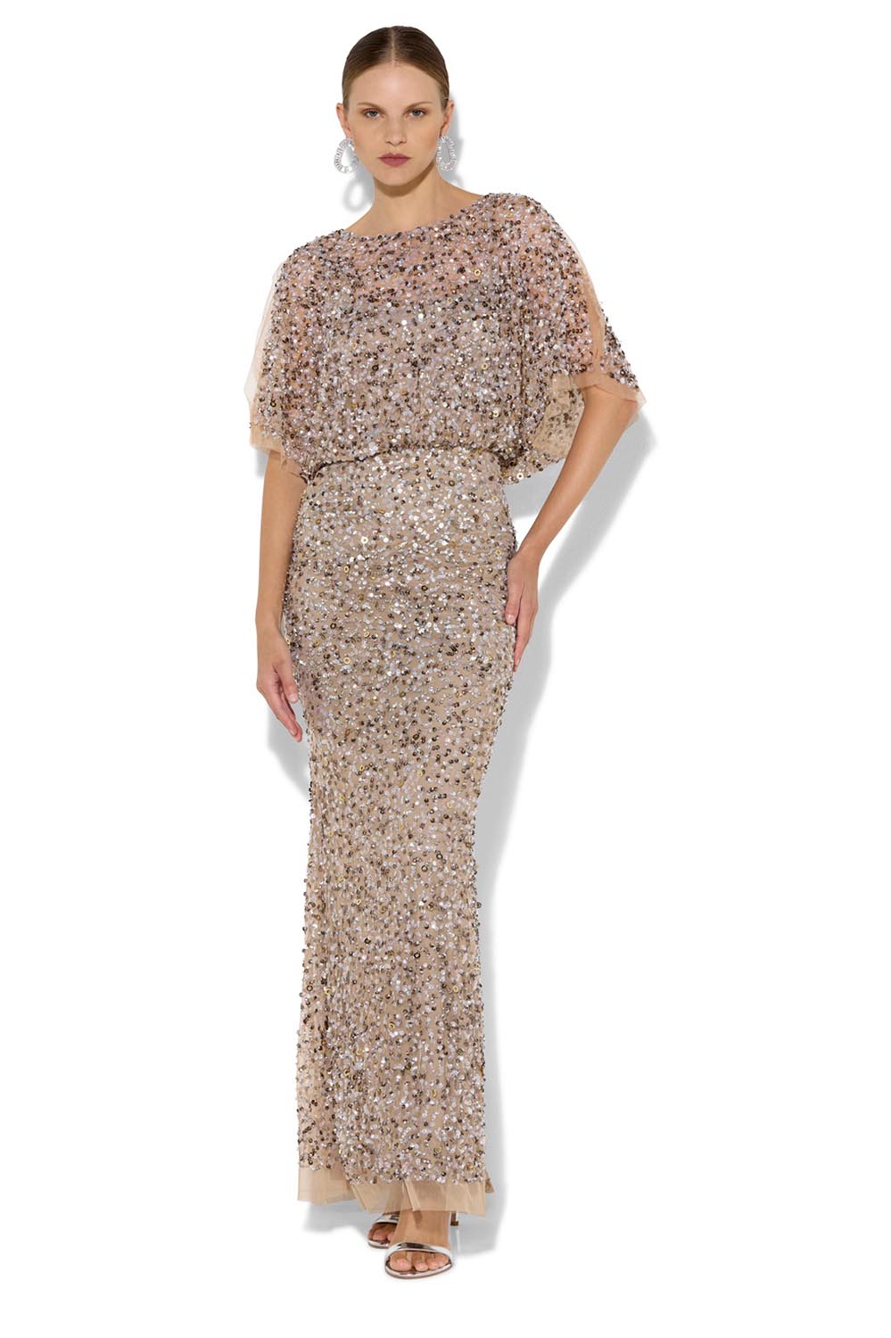 A model wearing the Mimi Hand Beaded Gown in colour Mink, from the front, showing the whole outfit