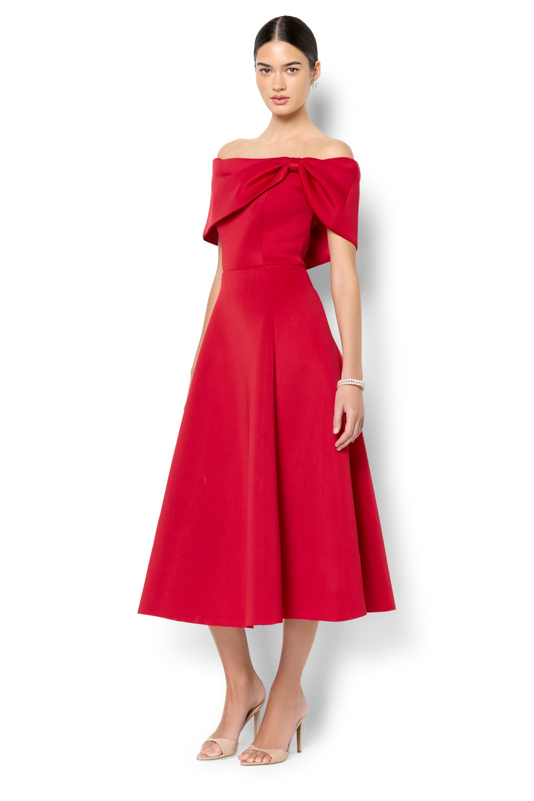 A model wearing the Rowan Cocktail Dress in colour Red (Red), from the front, showing the whole outfit