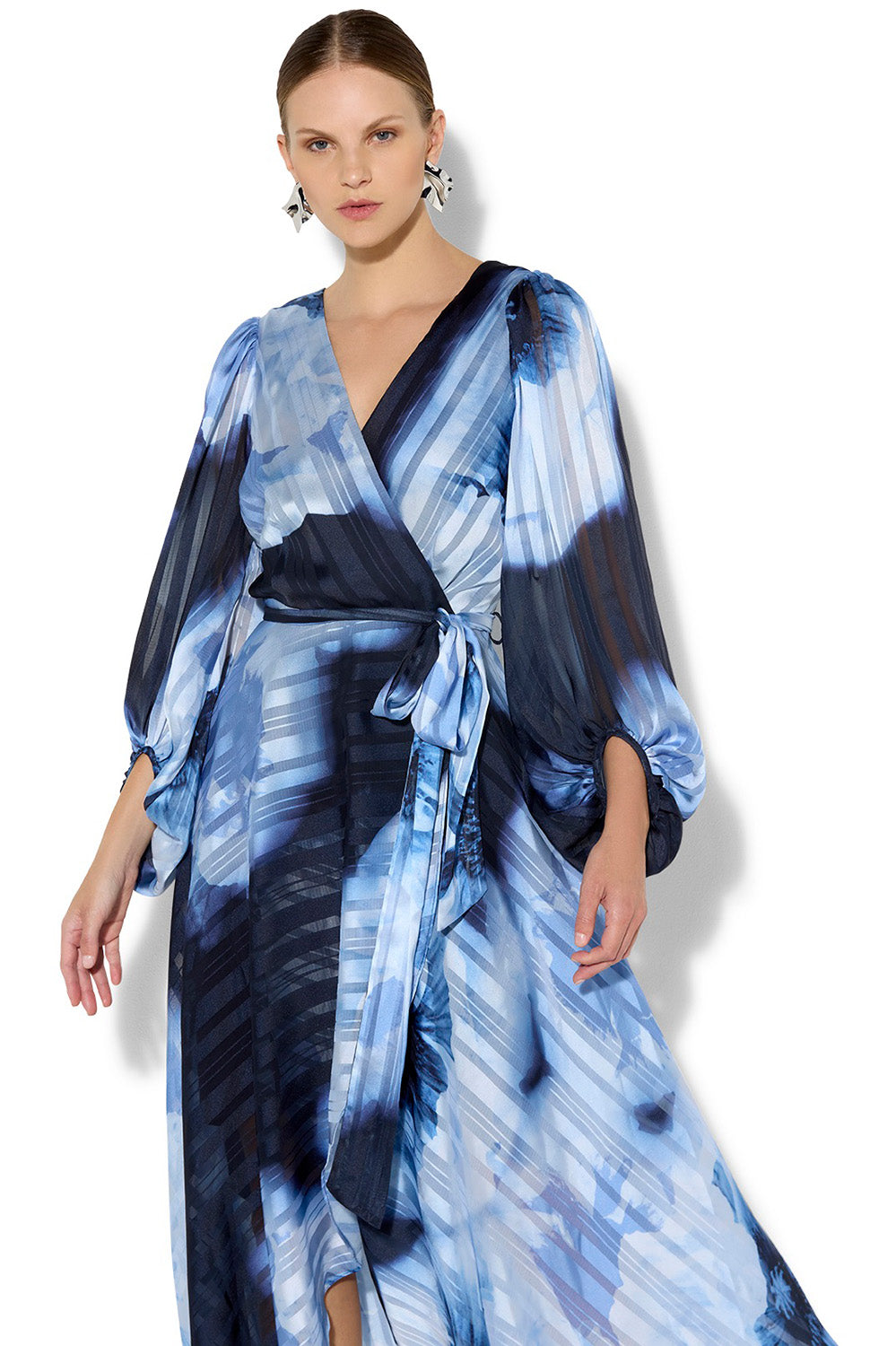 A model wearing the Salina Printed Maxi Dress in colour Navysky (Blue), from the front, cropped image