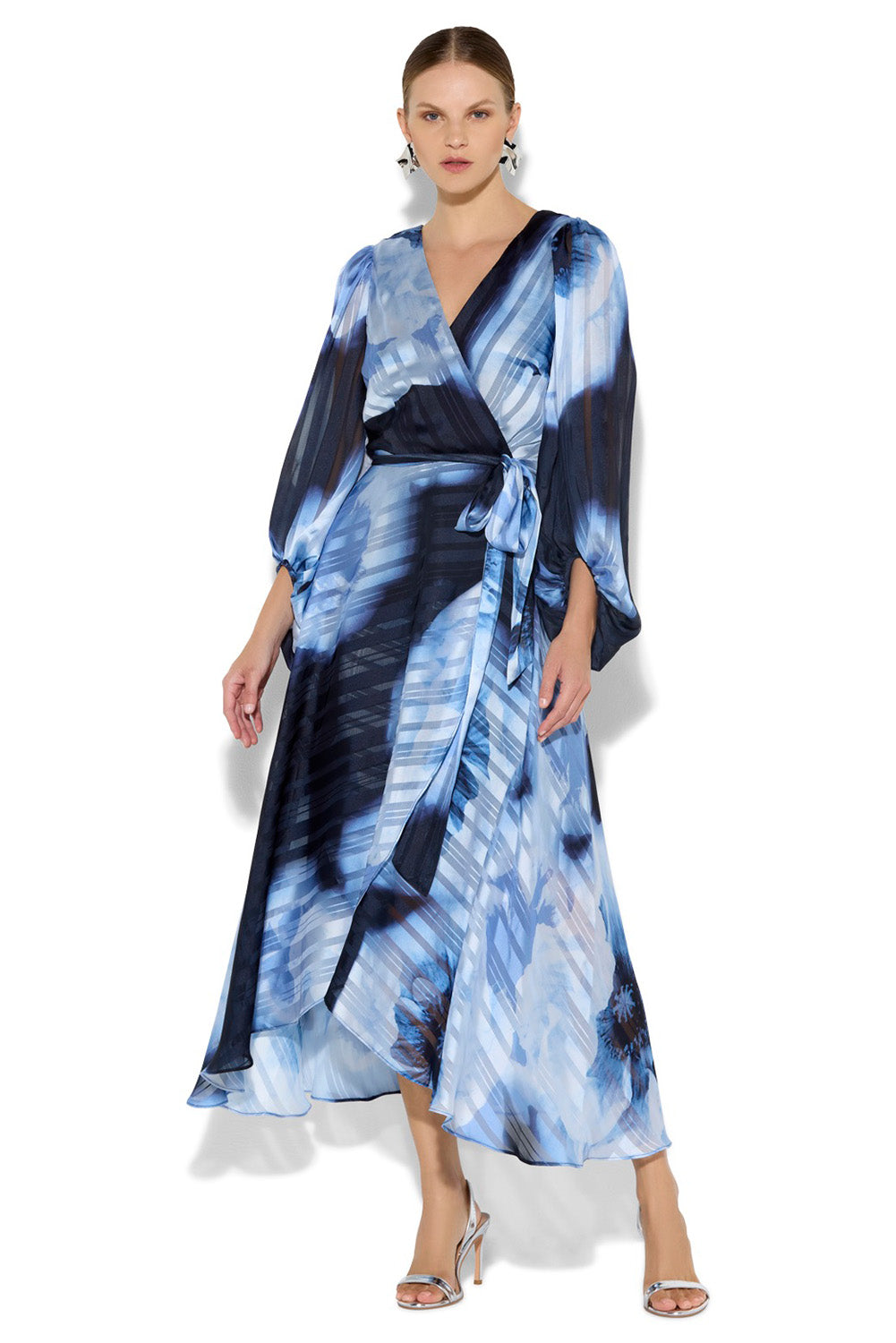 A model wearing the Salina Printed Maxi Dress in colour Navysky (Blue), from the front, showing the whole outfit