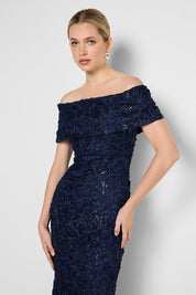 Model Genericm wearing size sample of the Emerson Off The Shoulder Gown - Navy in colour Navy, from an angle