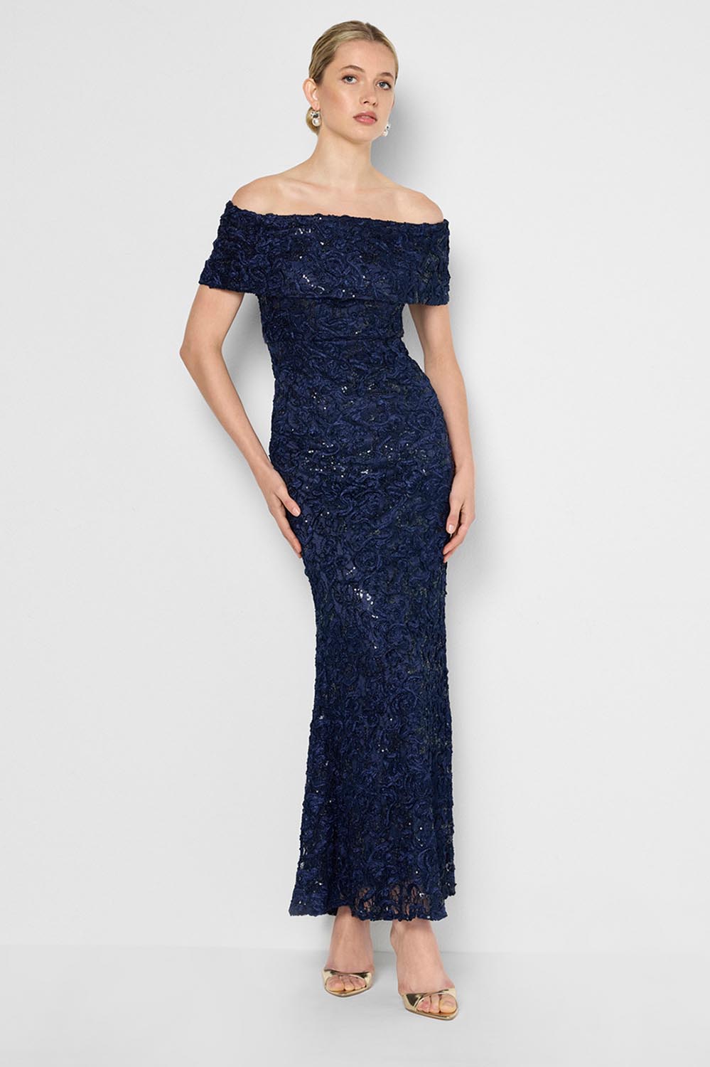 Model Genericm wearing size sample of the Emerson Off The Shoulder Gown - Navy in colour Navy, from the front