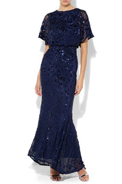 A model wearing the Aria Sequin Maxi Gown in colour Navy (Blue), from the front, cropped image