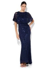 A model wearing the Aria Sequin Maxi Gown in colour Navy (Blue), from the front, showing the whole outfit