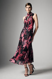 A model wearing the Imogen Merlot Floral Midi Dress in colour Merlot (Red), from the front, showing the whole outfit