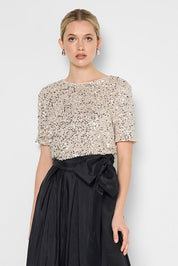 Model Genericm wearing size sample of the Ginger Sequin Top - Mink in colour Mink, in a cropped view