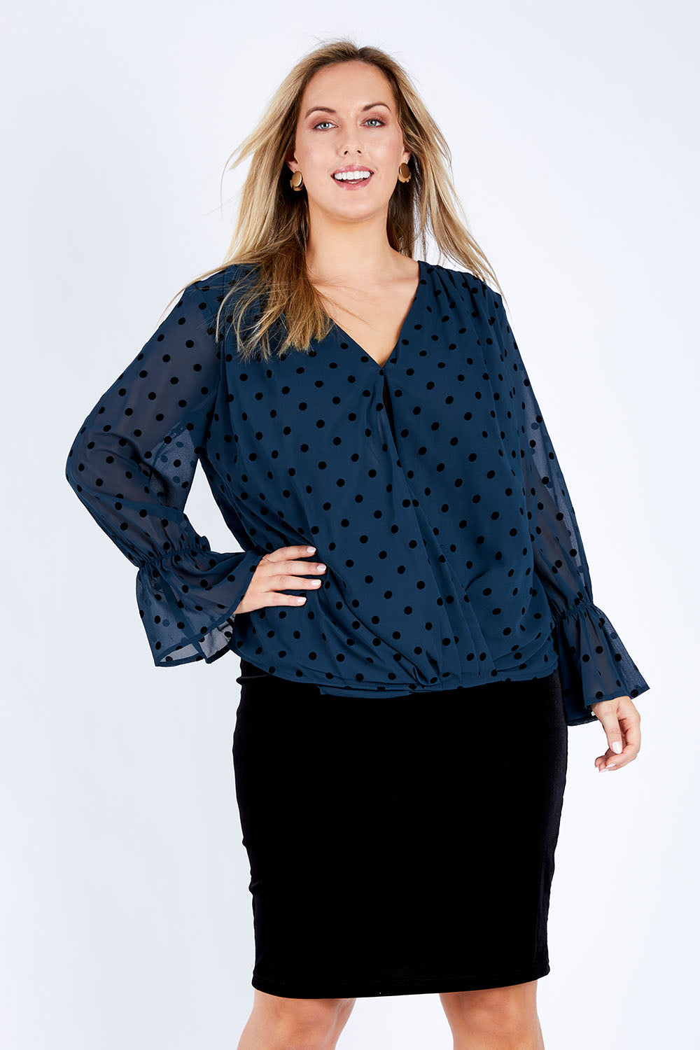 Model Jess wearing size 14 of the Roanna Skirt in colour Black (Black), from the front, cropped image