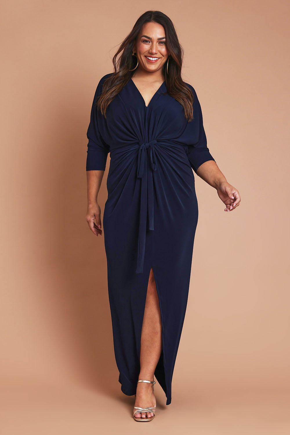 Model Ashleigh wearing size 16 of the Nadine Dress in colour NavyBlue (Blue), from the front, showing the whole outfit