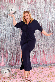 Model Caitlin wearing size 20 of the Nadine Dress in colour NavyBlue (Blue), from the front, showing the whole outfit