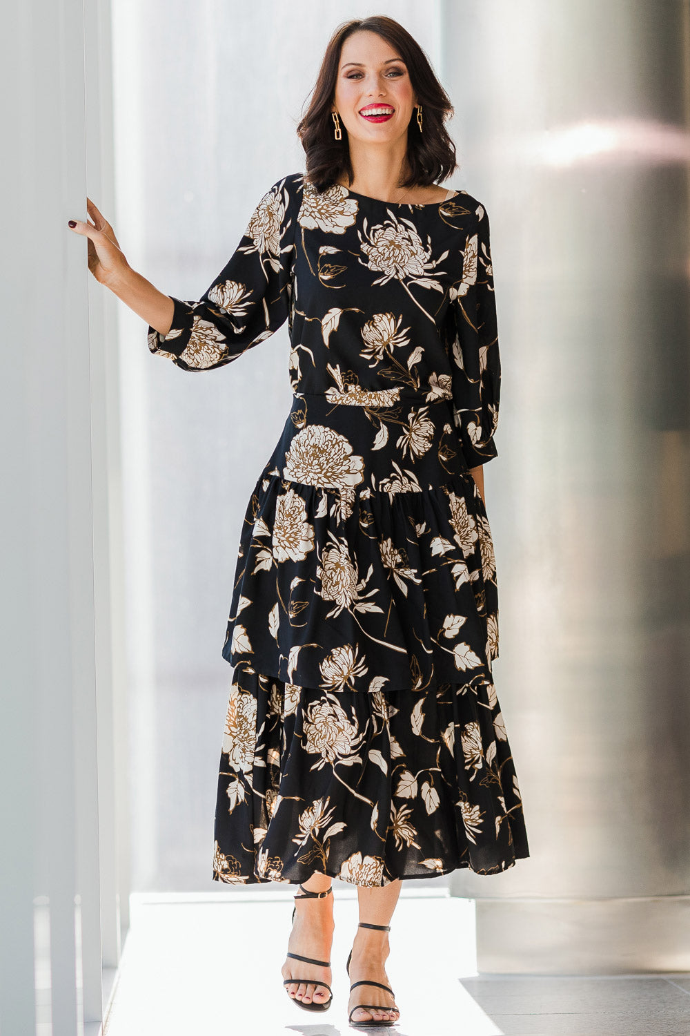 Model Andrea wearing size 10 of the Samara Skirt in colour Disbud (Black), from the front, showing the whole outfit