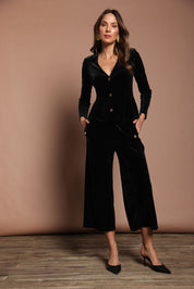 Model Madeline wearing size 10 of the Samantha Velvet Culottes in colour Black (Black), from the front, showing the whole outfit