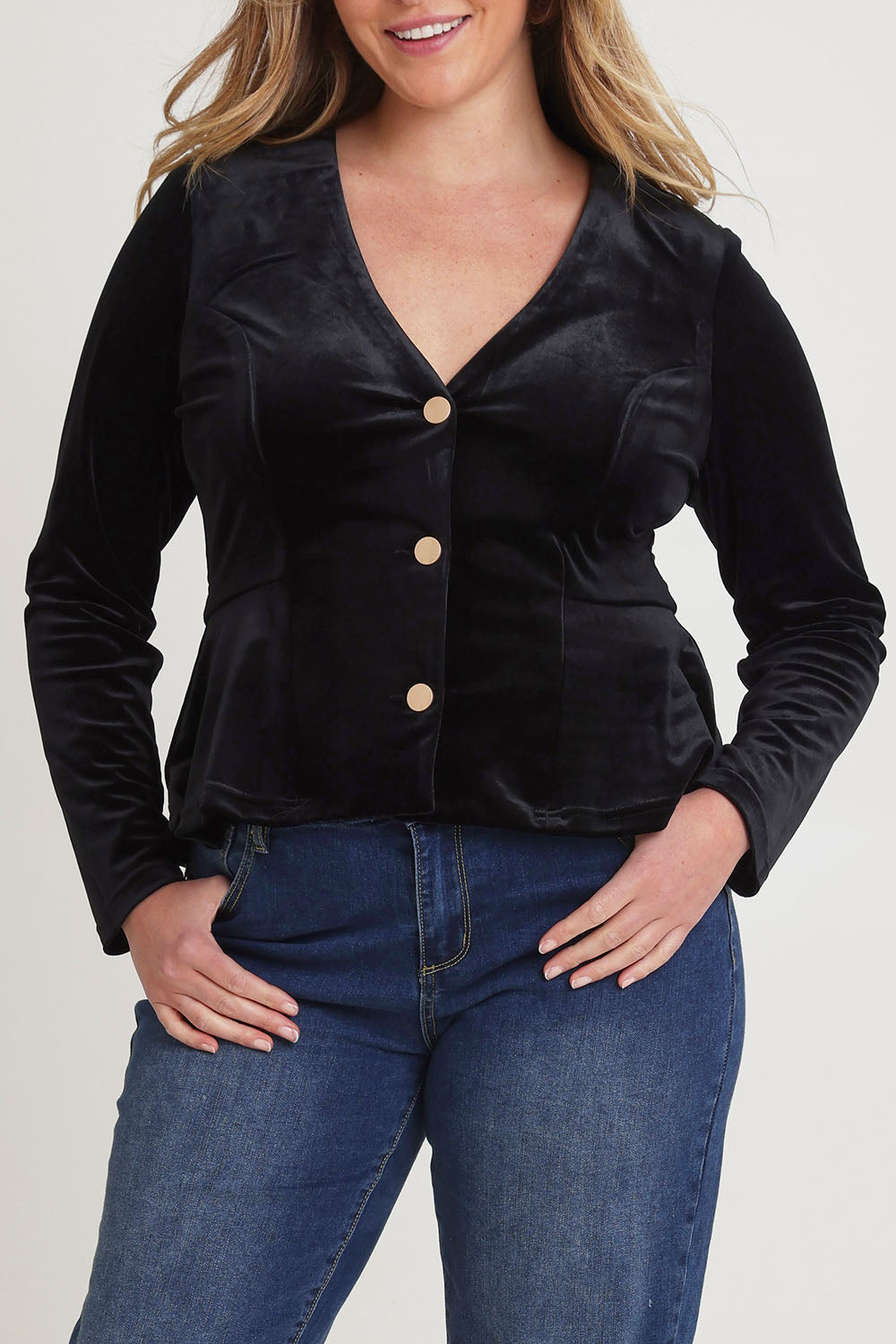 Model Chanel wearing size 16 of the Dawn Velvet Jacket in colour Black (Black), from the front, cropped image