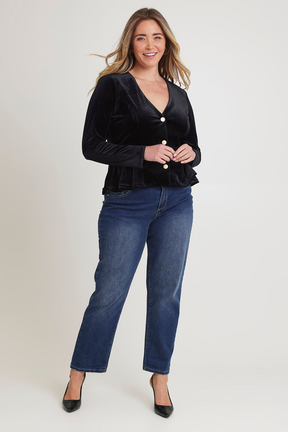 Model Chanel wearing size 16 of the Dawn Velvet Jacket in colour Black (Black), from the front, showing the whole outfit