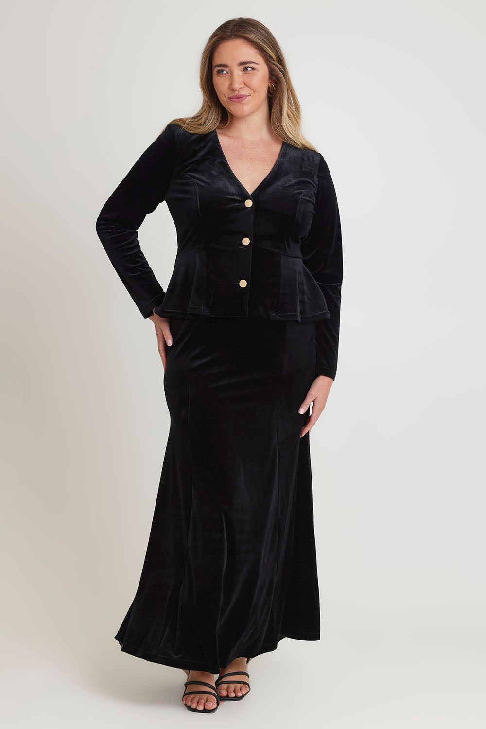 Model Chanel wearing size 16 of the Dawn Velvet Jacket in colour Black (Black), from the front, showing the whole outfit