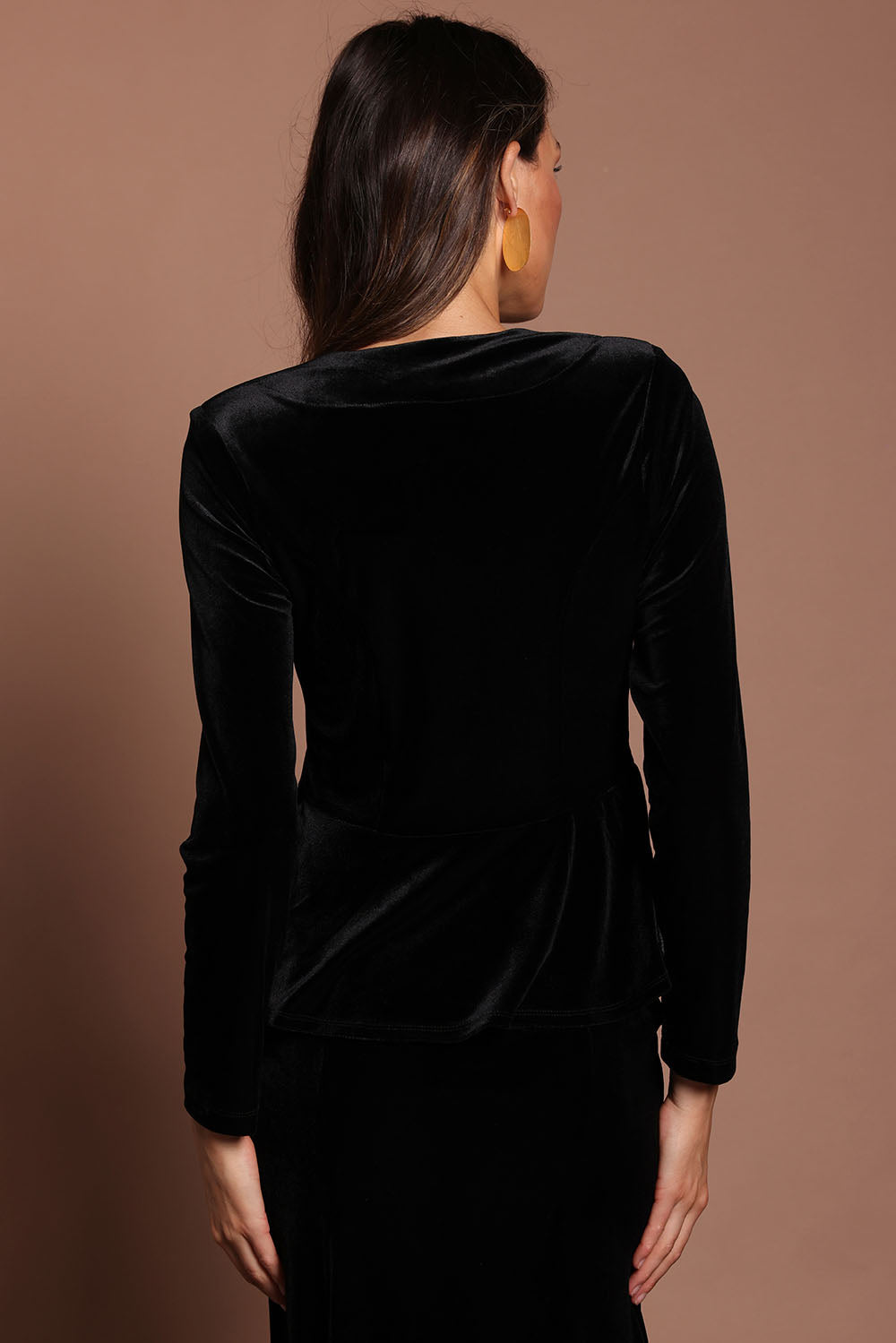 Model Madeline wearing size 10 of the Dawn Velvet Jacket in colour Black (Black), from the back