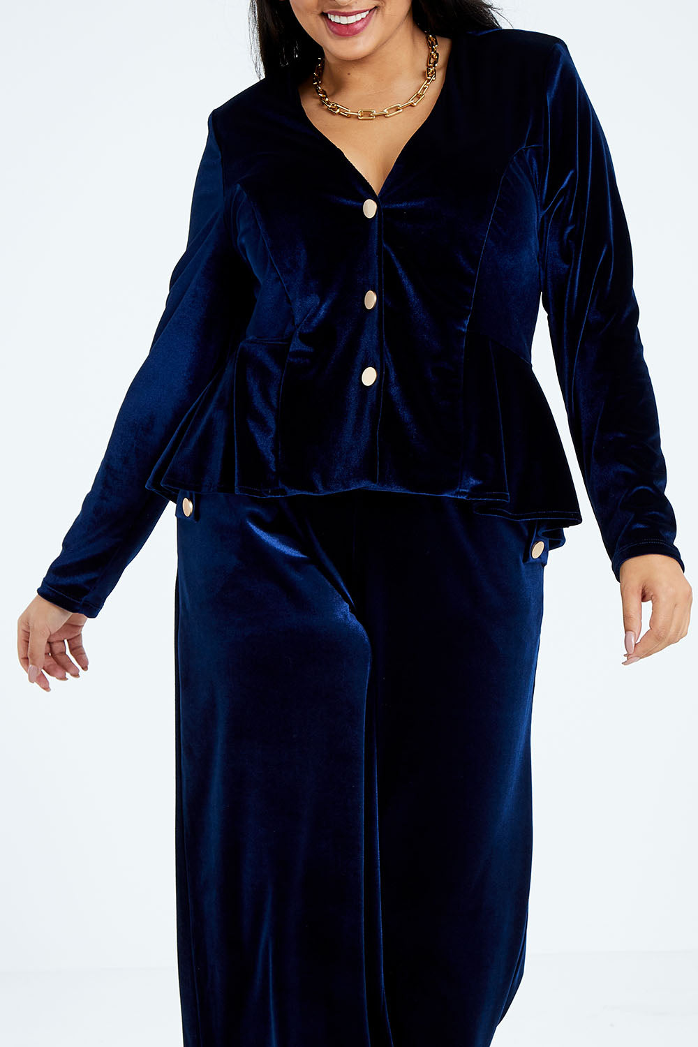 Model Sasha-Lee wearing size 16 of the Dawn Velvet Jacket in colour Moonlight (Blue), from the front, cropped image