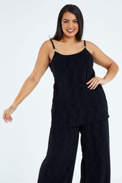 Model Sasha-Lee wearing size 16 of the Donna Glamorous Top in colour Midnight (Black), from the front, cropped image