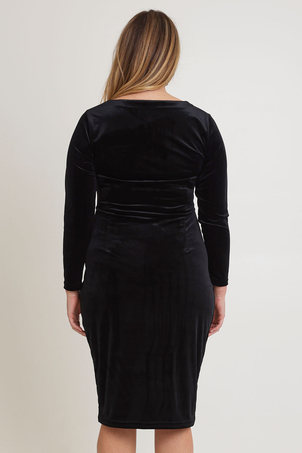 Model Chanel wearing size 16 of the Diana Velvet Dress in colour Black (Black), from the back