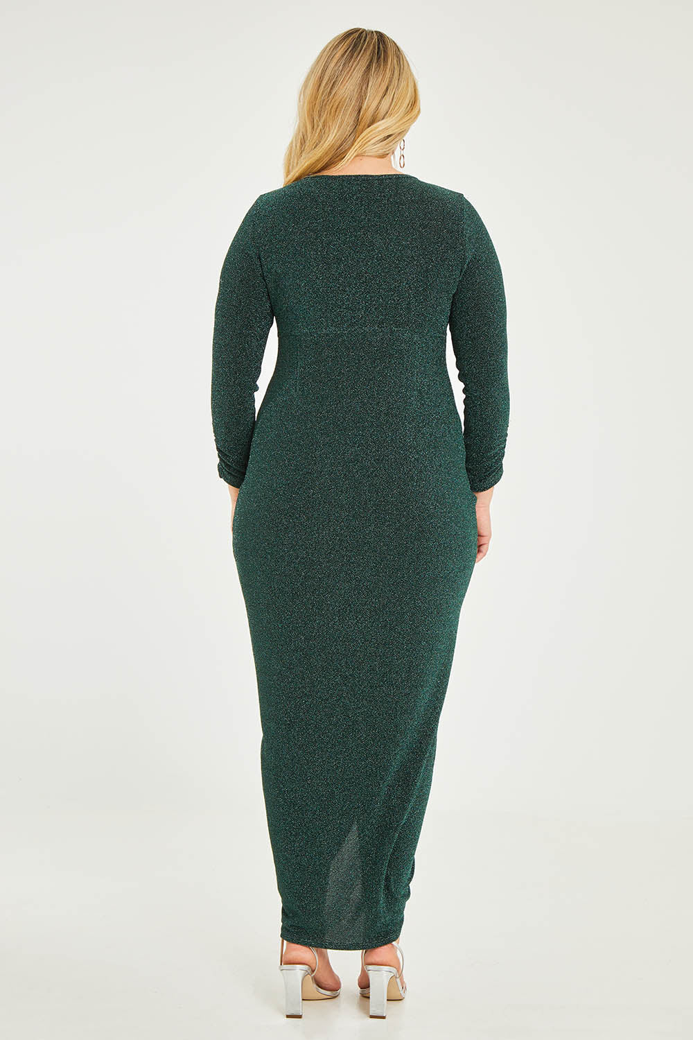 Model Katie wearing size 16 of the Carolyn Dress in colour Forest (Green), from the back