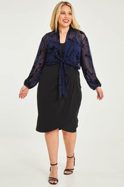 Model Katie wearing size 16 of the Penny Shrug in colour Navyfleur (Blue), from the front, showing the whole outfit