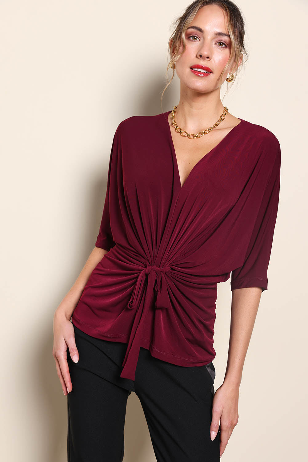 Model Maddiec wearing size 10 of the Niamh Top – Port in colour Port, in a cropped view