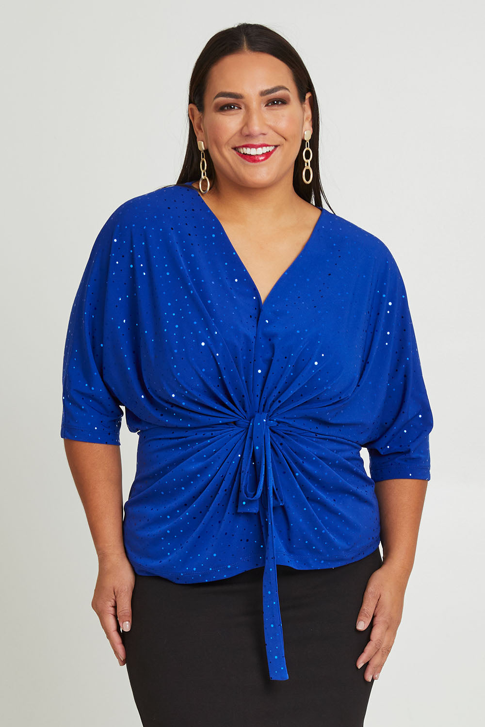 Model Ashleigh wearing size 16 of the Niamh Top in colour Cobalt (Blue), from the front, cropped image
