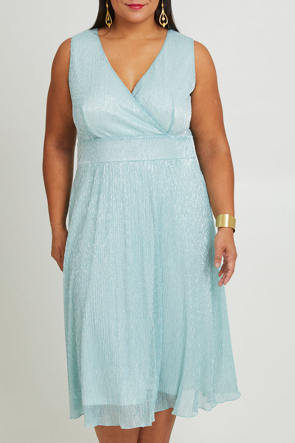 Model Ashleigh wearing size 16 of the Sally Ann Dress in colour Oasis (Green), from the front, cropped image