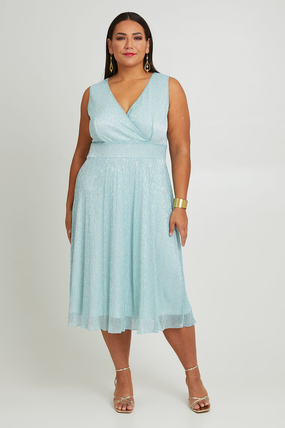 Model Ashleigh wearing size 16 of the Sally Ann Dress in colour Oasis (Green), from the front, showing the whole outfit