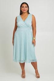 Model Ashleigh wearing size 16 of the Sally Ann Dress in colour Oasis (Green), from the front, showing the whole outfit