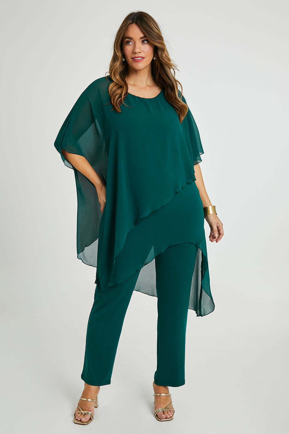 Model Laura wearing size 14 of the Sandy Jumpsuit in colour Pine (Green), from the front, showing the whole outfit