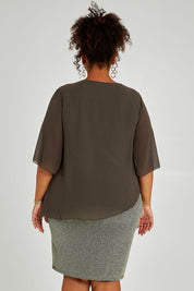 Model Alexis wearing size 16 of the Bridgette Dress in colour Khakisilv (Green), from the back